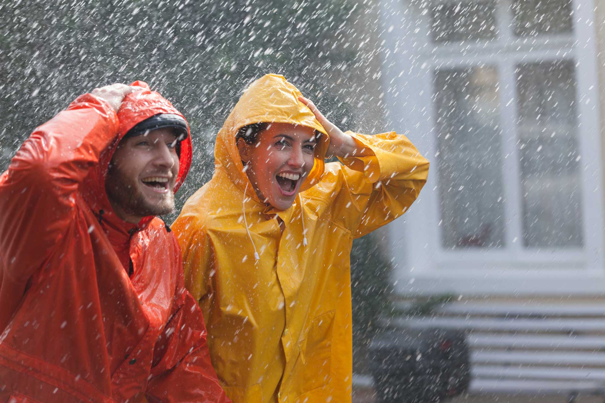 couple in rain with raincoats